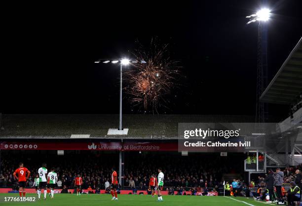 General view inside the stadium as a firework display illuminates the sky during the Premier League match between Luton Town and Liverpool FC at...