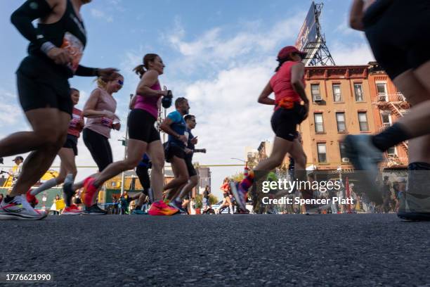 Runners make their way up 4th Avenue in Brooklyn during the New York City marathon on November 05, 2023 in New York City. Ethiopia’s Tamirat Tola set...