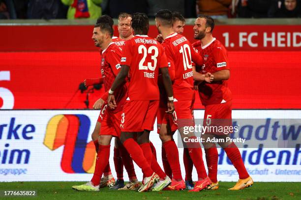 Jan Schoeppner of 1.FC Heidenheim celebrates with teammates after scoring the team's first goal during the Bundesliga match between 1. FC Heidenheim...