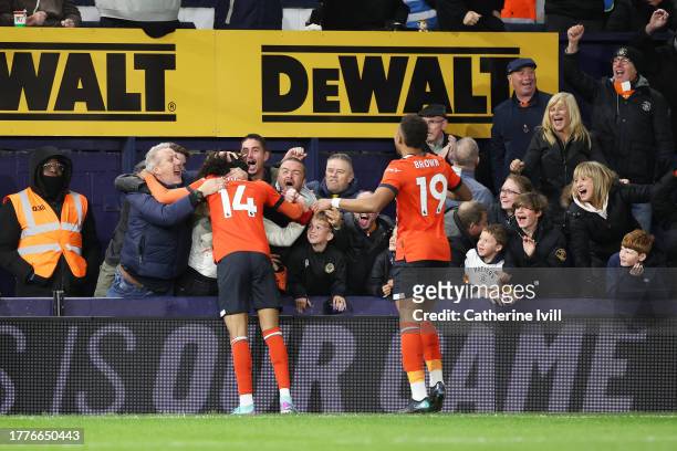 Tahith Chong of Luton Town celebrates after scoring the team's first goal during the Premier League match between Luton Town and Liverpool FC at...