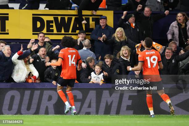 Tahith Chong of Luton Town celebrates after scoring the team's first goal during the Premier League match between Luton Town and Liverpool FC at...