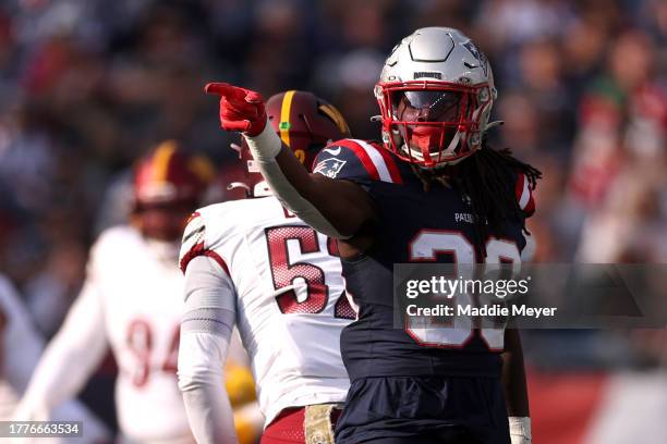 Rhamondre Stevenson of the New England Patriots reacts after a first down during the first quarter in the game against the Washington Commanders at...