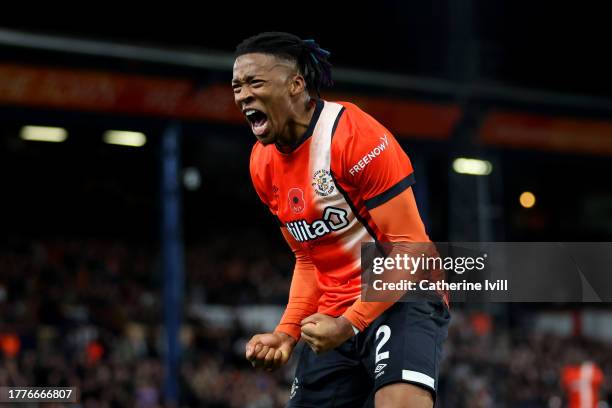 Gabriel Osho of Luton Town encourages the fans during the Premier League match between Luton Town and Liverpool FC at Kenilworth Road on November 05,...