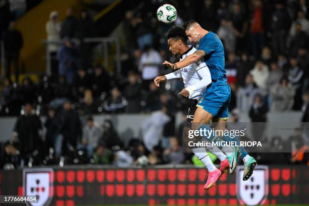 Porto's Portuguese defender Fabio Cardoso vies with Vitoria Guimaraes' Angolan forward Nelson da Luz during the Portuguese League football match...