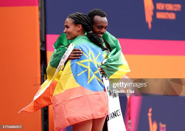 Letesenbet Gidey of Ethiopia and Tamirat Tola of Ethiopia congratulate each other after the 2023 TCS New York City Marathon on November 05, 2023 in...