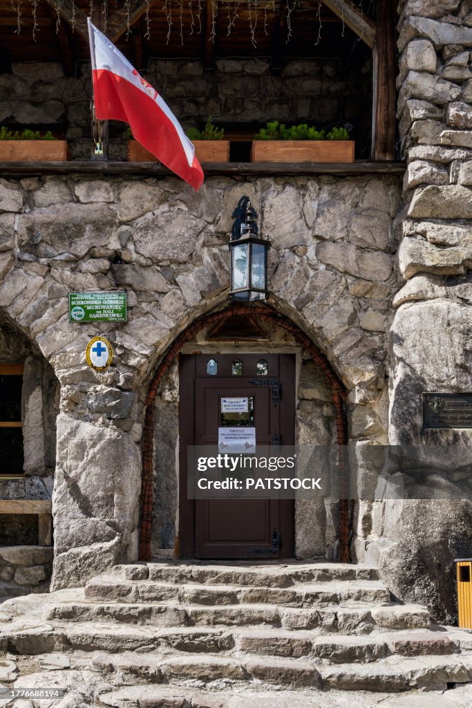 Polish flag over the door of the mountain chalet