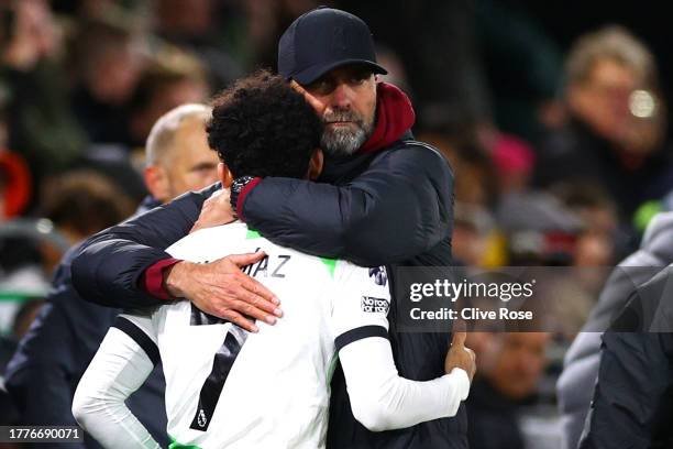 Juergen Klopp, Manager of Liverpool, embraces Luis Diaz of Liverpool before being substituted on during the Premier League match between Luton Town...