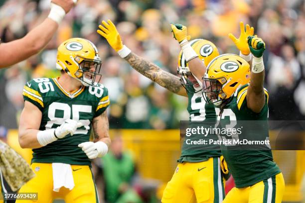 Aaron Jones of the Green Bay Packers and teammates celebrate after a touchdown in the second quarter of a game against the Los Angeles Rams at...