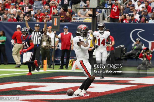 Rachaad White of the Tampa Bay Buccaneers reacts after scoring a touchdown in the second quarter of a game against the Houston Texans at NRG Stadium...