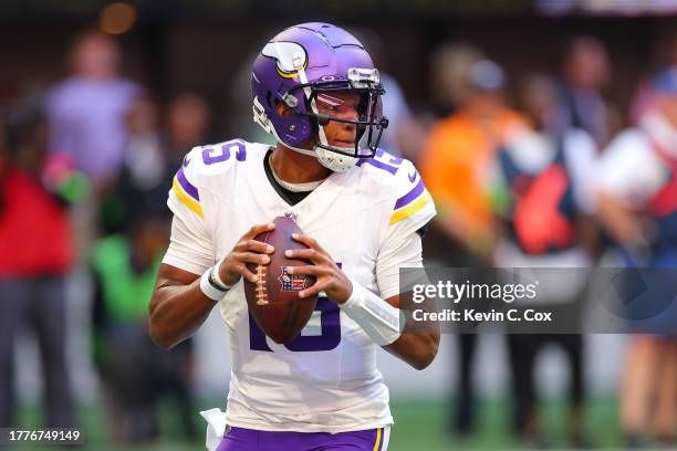 Joshua Dobbs of the Minnesota Vikings looks to pass against the Atlanta Falcons during the first half of the game at Mercedes-Benz Stadium on...