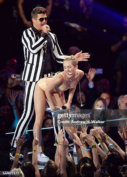Robin Thicke and Miley Cyrus perform onstage during the 2013 MTV Video Music Awards at the Barclays Center on August 25, 2013 in the Brooklyn borough...