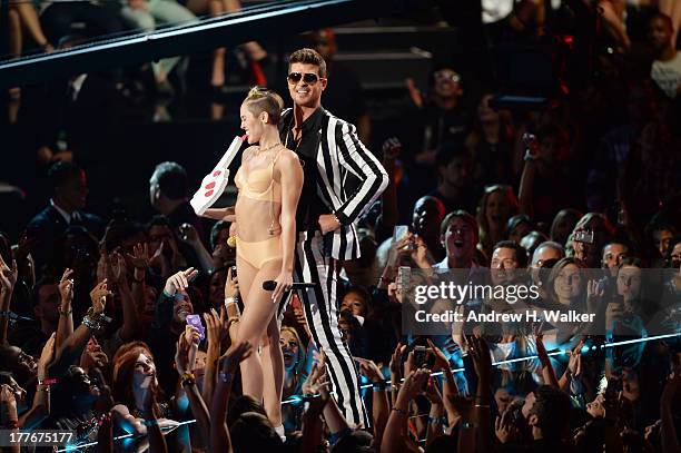 Miley Cyrus and Robin Thicke perform onstage during the 2013 MTV Video Music Awards at the Barclays Center on August 25, 2013 in the Brooklyn borough...