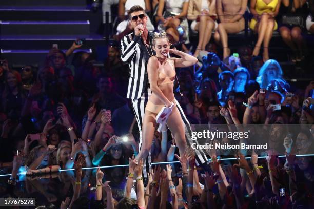 Miley Cyrus and Robin Thicke perform onstage during the 2013 MTV Video Music Awards at the Barclays Center on August 25, 2013 in the Brooklyn borough...