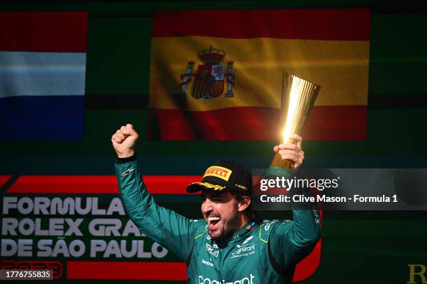 Third placed Fernando Alonso of Spain and Aston Martin F1 Team celebrates on the podium during the F1 Grand Prix of Brazil at Autodromo Jose Carlos...