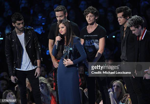 Selena Gomez, Zayn Malik, Liam Payne, Louis Tomlinson, Harry Styles, and Niall Horan of one Direction speak onstage during the 2013 MTV Video Music...