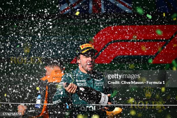 Third placed Fernando Alonso of Spain and Aston Martin F1 Team celebrates on the podium during the F1 Grand Prix of Brazil at Autodromo Jose Carlos...