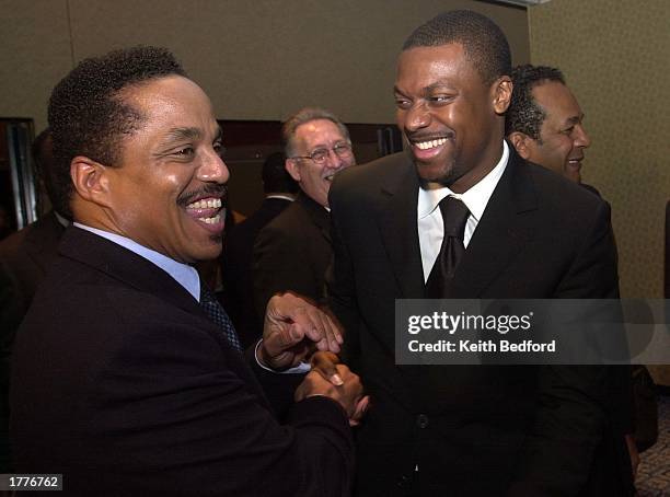 Actor Chris Tucker laughs with Marlon Jackson at a news conference announcing the Major Broadcasting Cable Network's 24 hour news channel February...