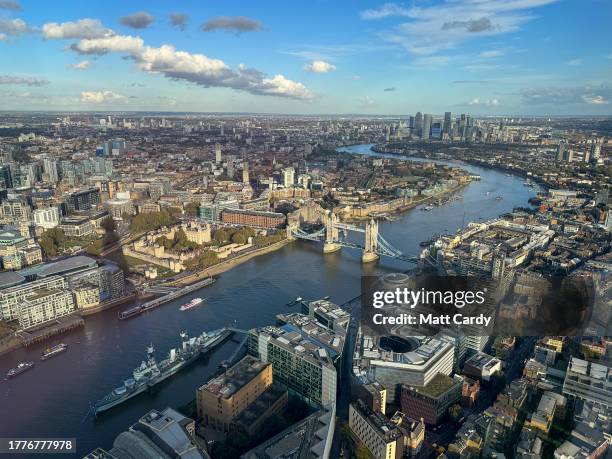 Vehicles pass over Tower Bridge which spans the River Thames on October 24, 2023 in London, England. With an array of notable tourist attractions,...