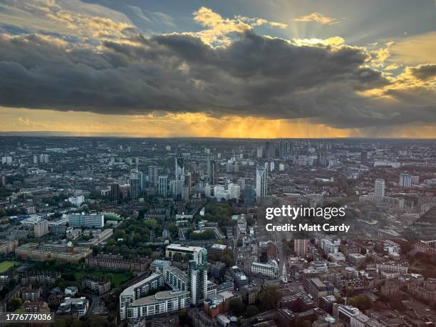 Rain clouds gather above buildings in south London, on October 24, 2023 in London, England. According to a report from the Royal Institution of...