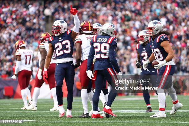 Kyle Dugger of the New England Patriots celebrates an interception during the second quarter in the game against the Washington Commanders at...