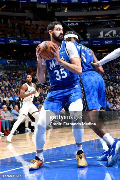 Goga Bitadze of the Orlando Magic grabs a rebound during the game against the Milwaukee Bucks on NOVEMBER 11, 2023 at Amway Center in Orlando,...
