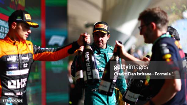 Third placed Fernando Alonso of Spain and Aston Martin F1 Team celebrates on the podium during the F1 Grand Prix of Brazil at Autodromo Jose Carlos...