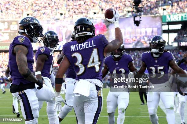 Keaton Mitchell of the Baltimore Ravens celebrates after a touchdown during the second half in the game against the Seattle Seahawks at M&T Bank...