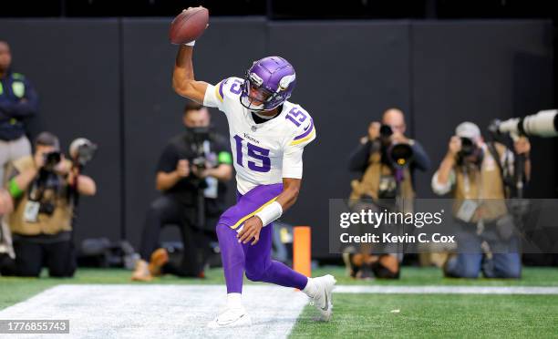 Joshua Dobbs of the Minnesota Vikings celebrates after scoring a touchdown during the third quarter of the game against the Atlanta Falcons at...