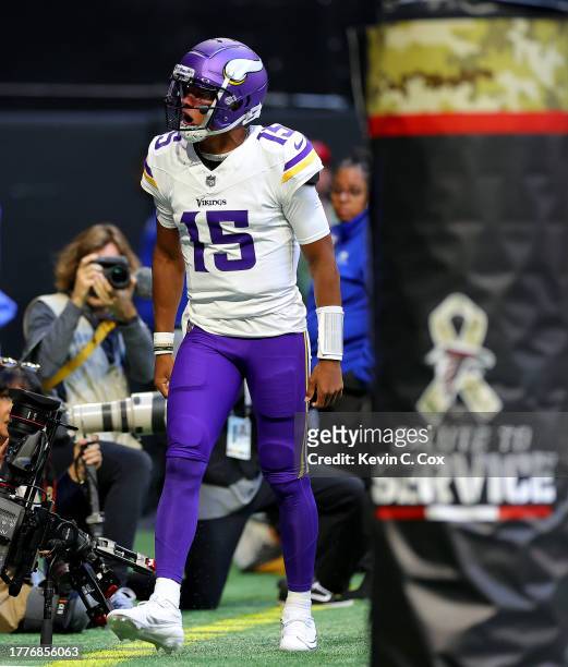 Joshua Dobbs of the Minnesota Vikings celebrates after scoring a touchdown during the third quarter of the game against the Atlanta Falcons at...