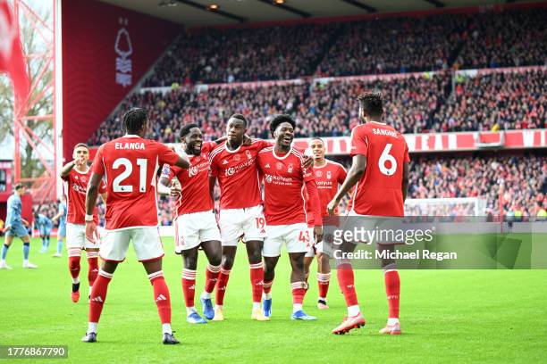 Ola Aina of Nottingham Forest celebrates with teammates after scoring the team's first goal during the Premier League match between Nottingham Forest...