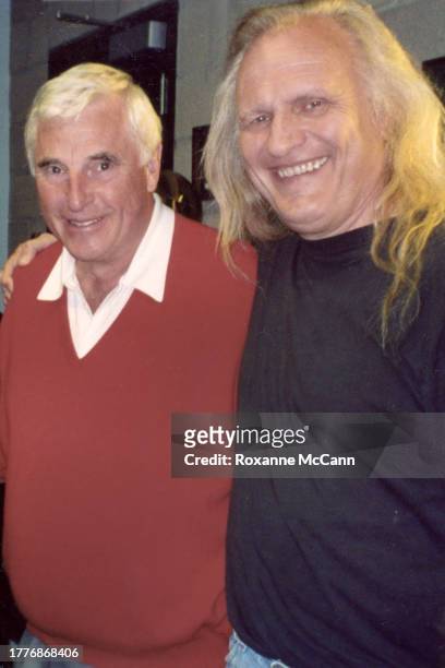 Bob "Bobby" Knight, wearing a red v-neck sweater, and Joe Pytka stop for a photo during the filming of a Minute Maid commercial in 2001 in Los...