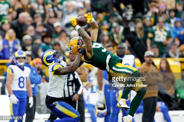 Christian Watson of the Green Bay Packers catches a pass in the fourth quarter of a game against the Los Angeles Rams at Lambeau Field on November...