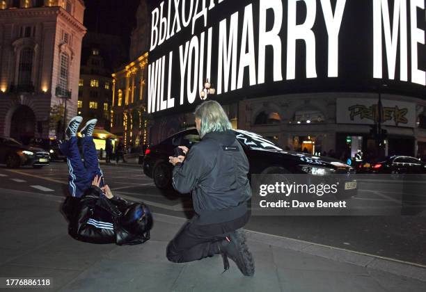 Nadya Tolokonnikova of Pussy Riot aka Nadezhda Tolokonnikova falls to the ground after a surprise marriage proposal from partner John Caudwell during...