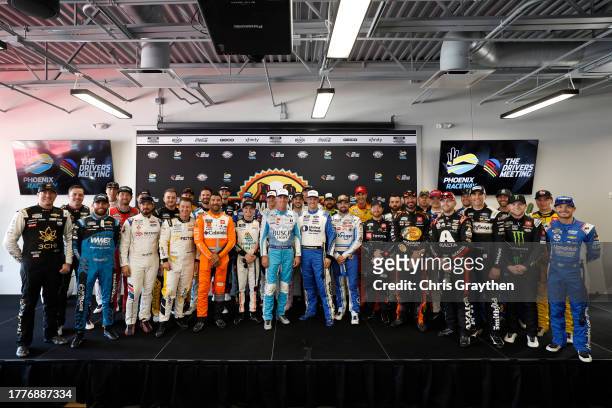 Retiring NASCAR Cup Series driver, Kevin Harvick, driver of the Busch Light Harvick Ford, takes a photo with the full field of the NASCAR Cup Series...