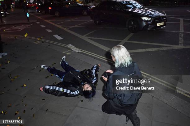 Nadya Tolokonnikova of Pussy Riot aka Nadezhda Tolokonnikova falls to the ground after a surprise marriage proposal from partner John Caudwell during...