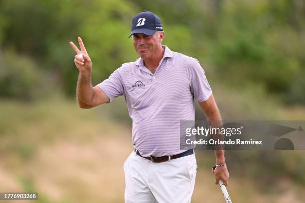 Matt Kuchar of the United States acknowledges fans after a putt on the ninth green during the final round of the World Wide Technology Championship...