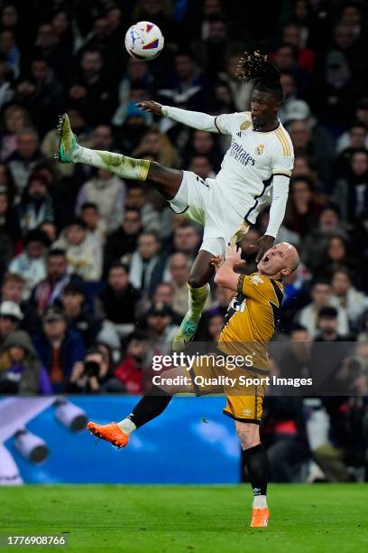 Eduardo Camavinga of Real Madrid CF battle for the ball with Isaac Palazon of Rayo Vallecano during the LaLiga EA Sports match between Real Madrid CF...