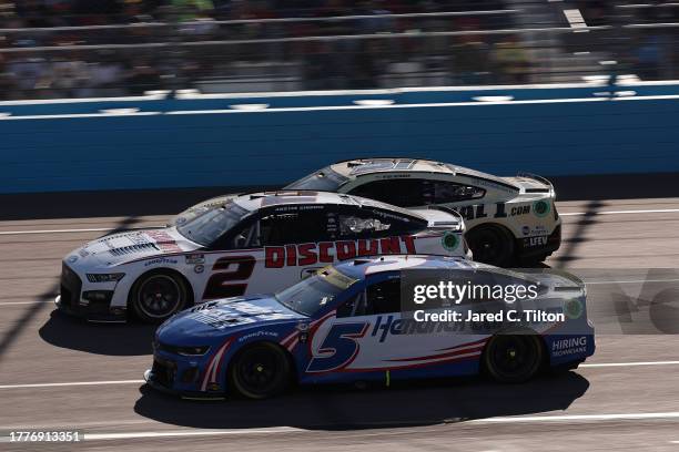 Kyle Larson, driver of the HendrickCars.com Chevrolet, Austin Cindric, driver of the Discount Tire Ford, and Ryan Newman, driver of the Serial 1...
