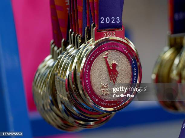 Race volunteers prepare participation medals near the finish line before the 2023 TCS New York City Marathon on November 05, 2023 in Central Park in...