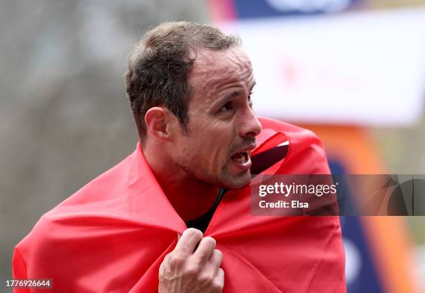 Marcel Hug of Switzerland reacts after he crossed the finish line to win the Men's Wheelchair division during the 2023 TCS New York City Marathon on...