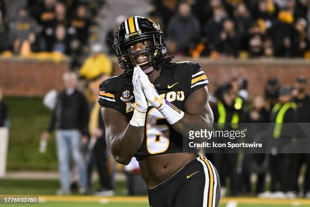 Missouri Tigers defensive lineman Darius Robinson motions thank you to the Tennessee sideline after a sack during a SEC conference game between the...