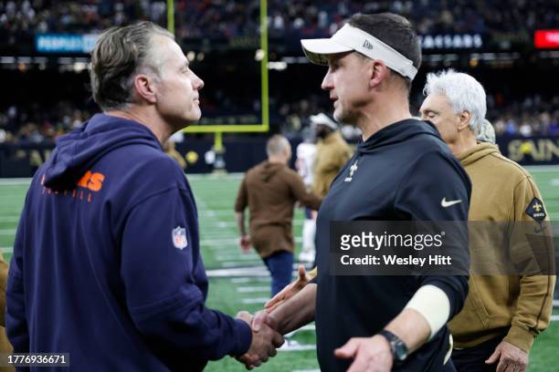Head coach Matt Eberflus of the Chicago Bears and Head coach Dennis Allen of the New Orleans Saints embrace after the game at Caesars Superdome on...