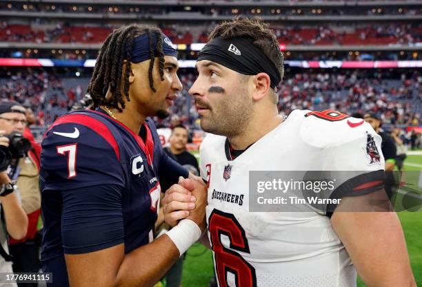 Stroud of the Houston Texans talks with Baker Mayfield of the Tampa Bay Buccaneers after a game at NRG Stadium on November 05, 2023 in Houston, Texas.