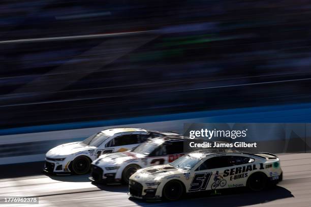 Ryan Newman, driver of the Serial 1 E-Bikes Ford, Austin Cindric, driver of the Discount Tire Ford, and AJ Allmendinger, driver of the Action...