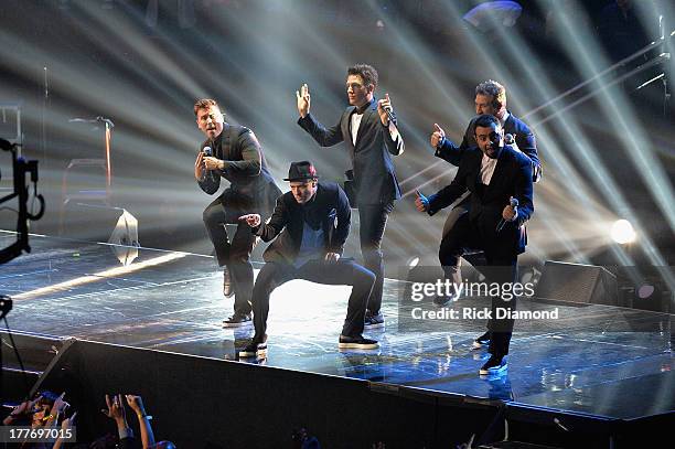 Chris Kirkpatrick, Joey Fatone, Justin Timberlake, JC Chasez and Lance Bass of 'N Sync perform during the 2013 MTV Video Music Awards at the Barclays...