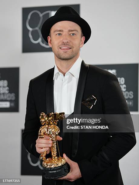 Justin Timberlake with the Michael Jackson Video Vanguard Award at the MTV Video Music Awards August 25, 2013 at the Barclays Center in New York. AFP...