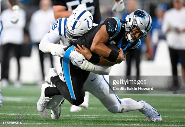 DeForest Buckner of the Indianapolis Colts tackles Bryce Young of the Carolina Panthers during the second quarter of the game at Bank of America...