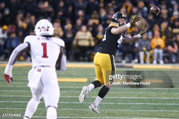 Tight end Zach Ortwerth of the Iowa Hawkeyes catches a pass during the second half against linebacker Mohamed Toure of the Rutgers Scarlet Knights at...