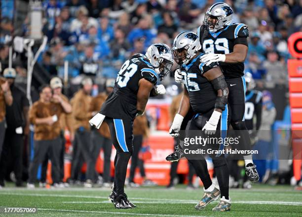 Derrick Brown of the Carolina Panthers celebrates with teammates after a tackle during the third quarter of the game against the Indianapolis Colts...