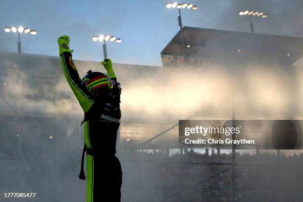 Ryan Blaney, driver of the Menards/Dutch Boy Ford, celebrates after winning the 2023 NASCAR Cup Series Championship, finishing first of the...